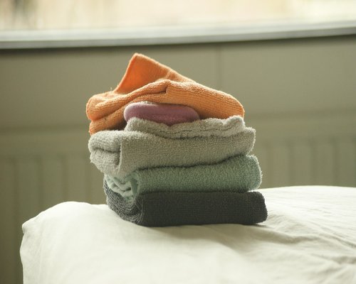 Neatly folded clothes and fresh towels